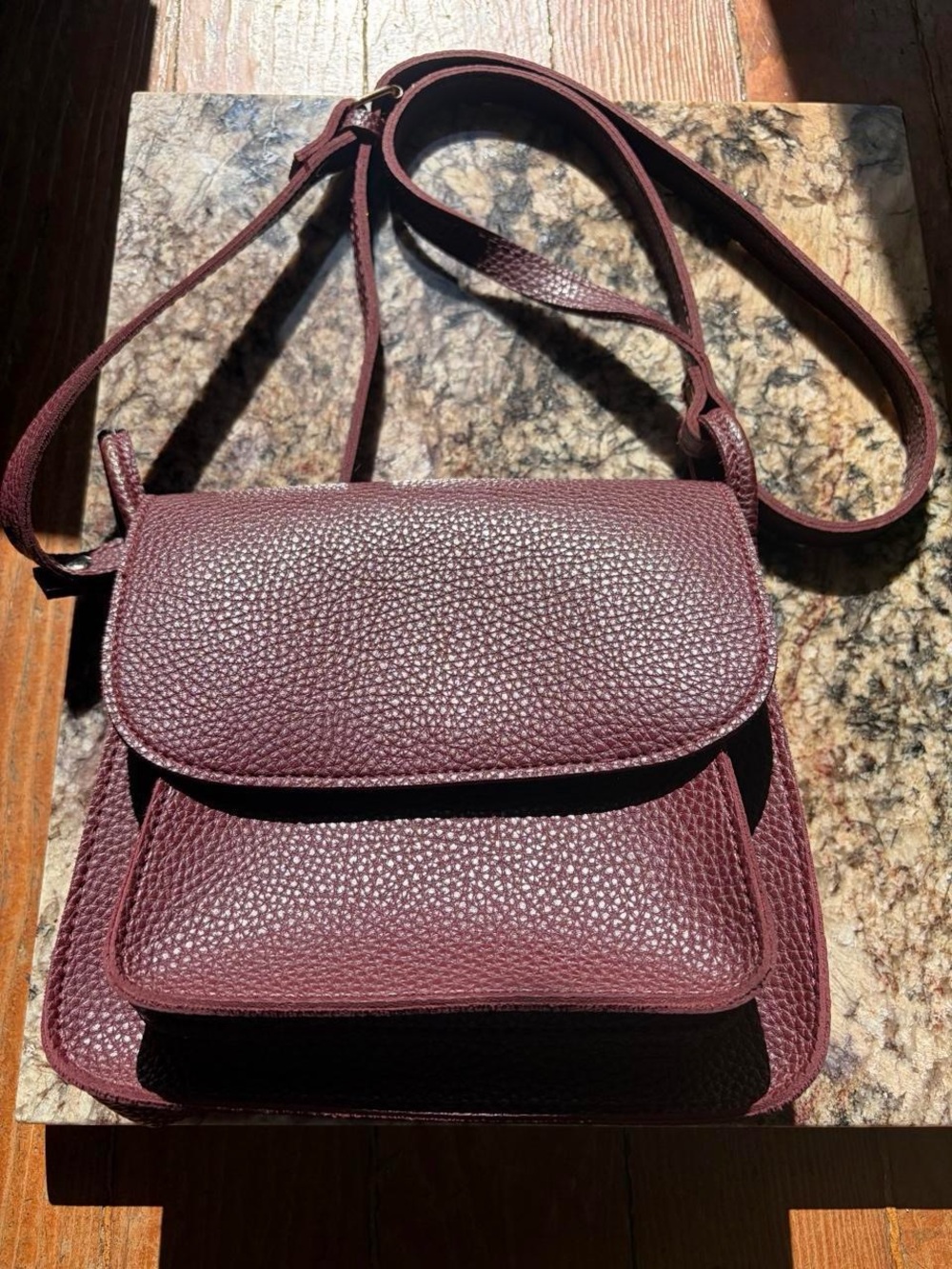 Burgundy faux pebbled leather purse with gold tone hardware